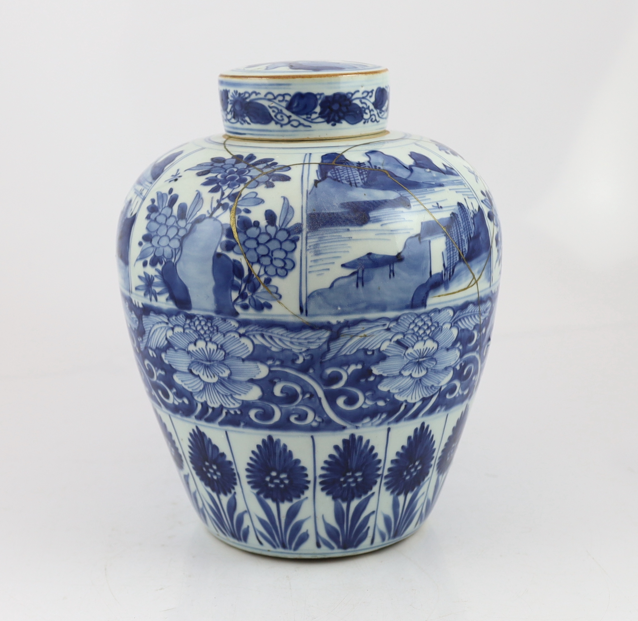 A Chinese blue and white ovoid jar and cover, Kangxi period, broken with kintsugi repair